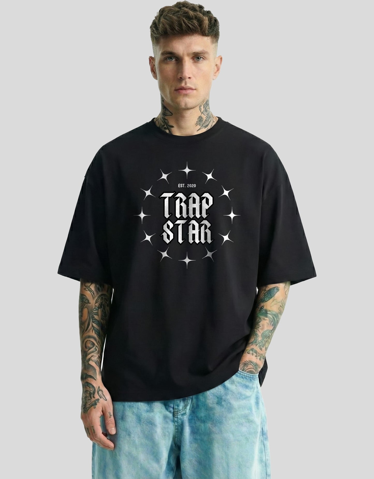 Black oversized graphic tee with TRAP STAR text and stars print - Heistt streetwear